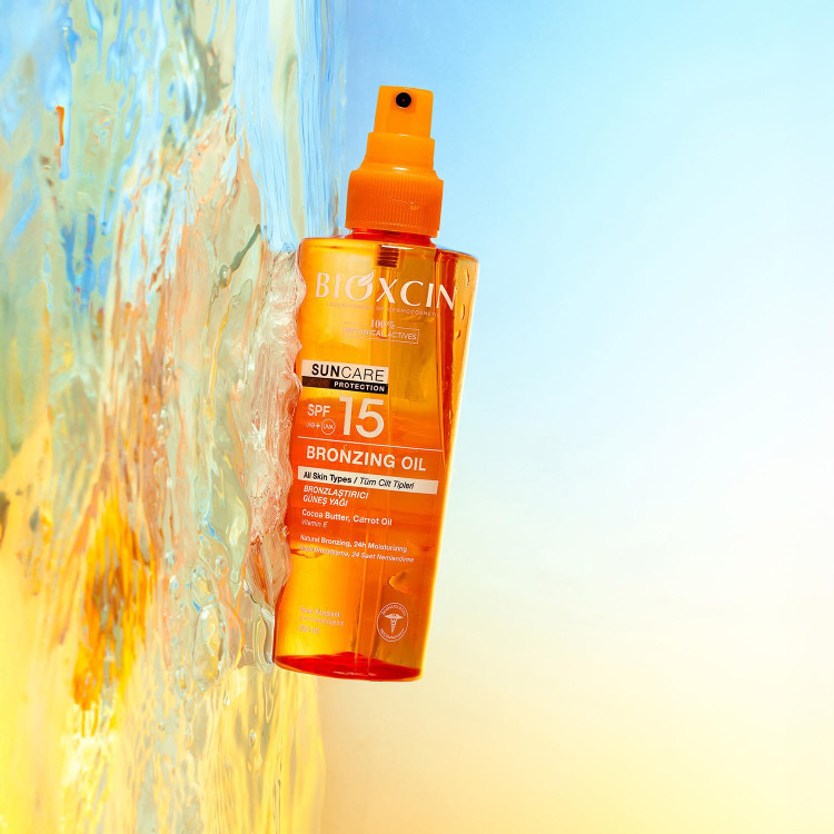 روغن برنزه کننده بدن بیوکسین Bioxcin با spf 15 مناسب انواع پوست حجم 200 میل